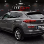 Hyundai Tucson 2019 сірий вид збоку для оренди