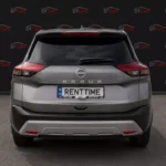 Nissan Rogue 2023 сірий вид збоку для оренди
