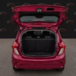 Chevrolet Spark 2019 червоний вид збоку для оренди